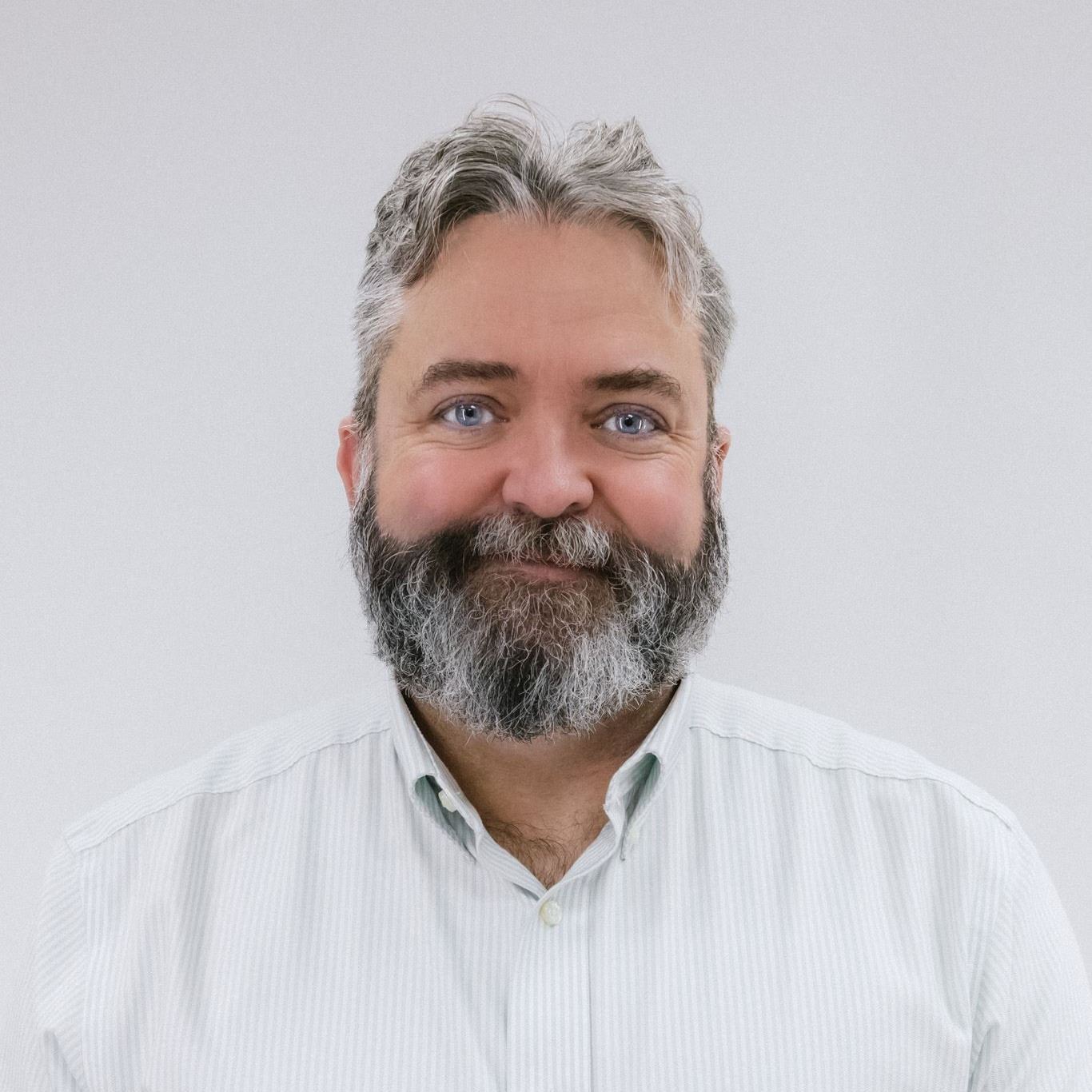 Councilor Jarrod Moreau photographed in front of white background