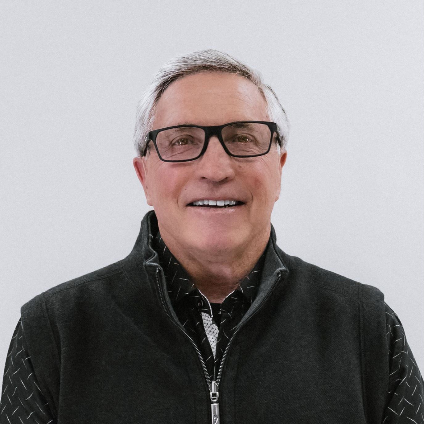 Councilor Dickie Townley photographed in front of a white background
